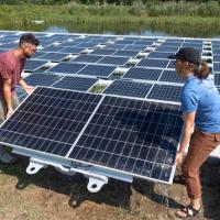 Installing solar panels by Jason Koski, Cornell University Photography.