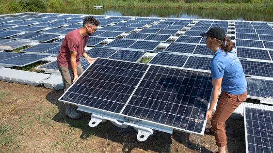 Installing solar panels by Jason Koski, Cornell University Photography.