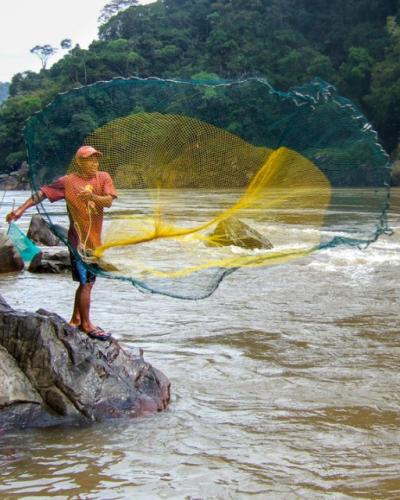 Fishermen cast their nets in the Amazon River by Alex Flecker.