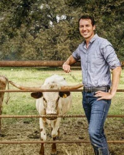 Ben Houlton on a ranch with livestock