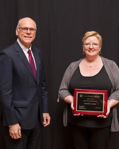 Patty Jordan, one of our administrative employees, with her core value award for communication